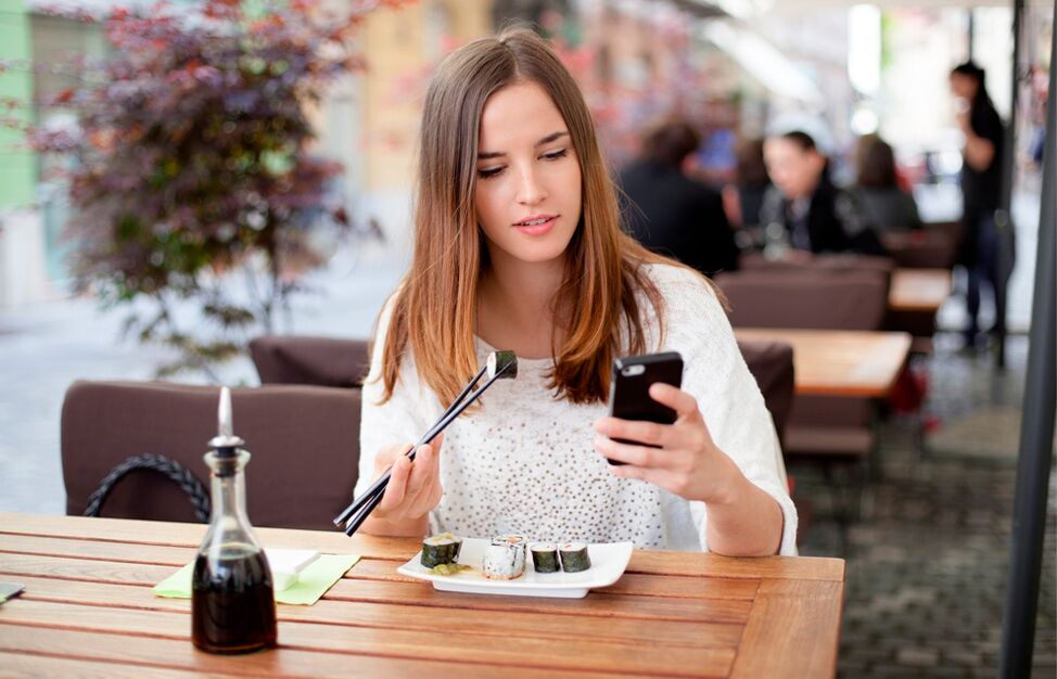 Girl getting distracted while eating eats more than she needs